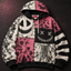 Patchwork Grin Unisex Hoodie — Stitched Smile Pink Gothic Print
