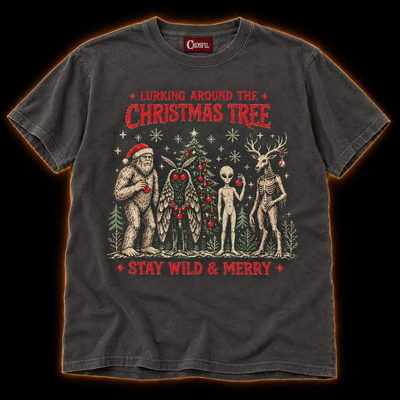 Lurking Around The Tree pepper cryptid Christmas T-shirt — Bigfoot in a Santa hat, Mothman, alien and antlered forest creature by a Christmas tree