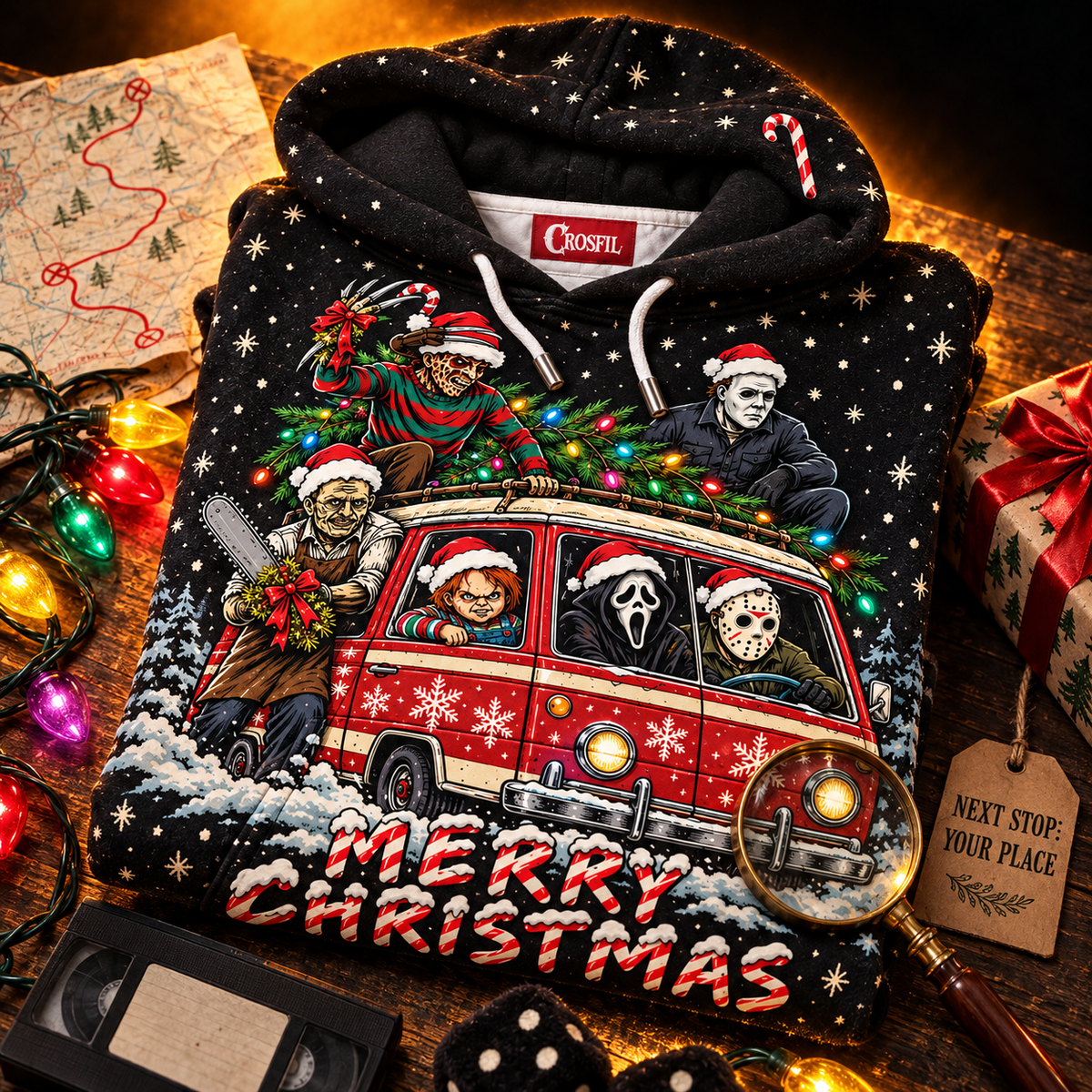 Slay Ride hoodie folded with a road map, Christmas lights, a VHS tape and fuzzy dice
